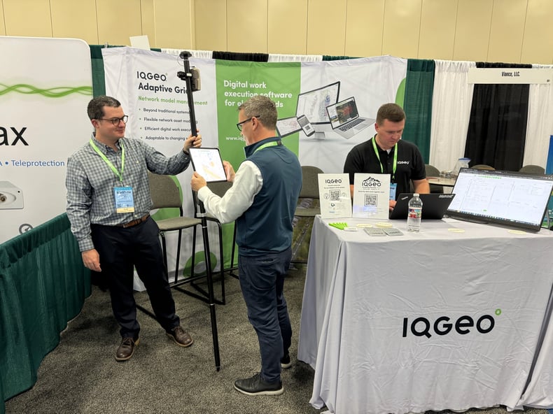 IQGeo-Matt-Roberts-Adrian-McNulty-Andrew-Sauerwin-Stand-Setup-TechAdvantage-2024-San-Antonio-TX-04Mar24